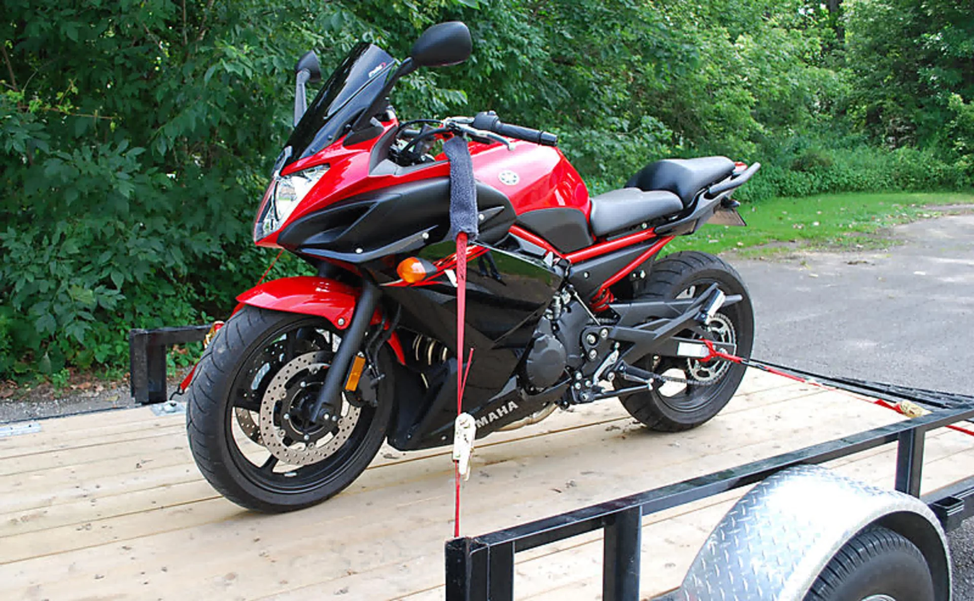 a truck loaded with motorcycles.png