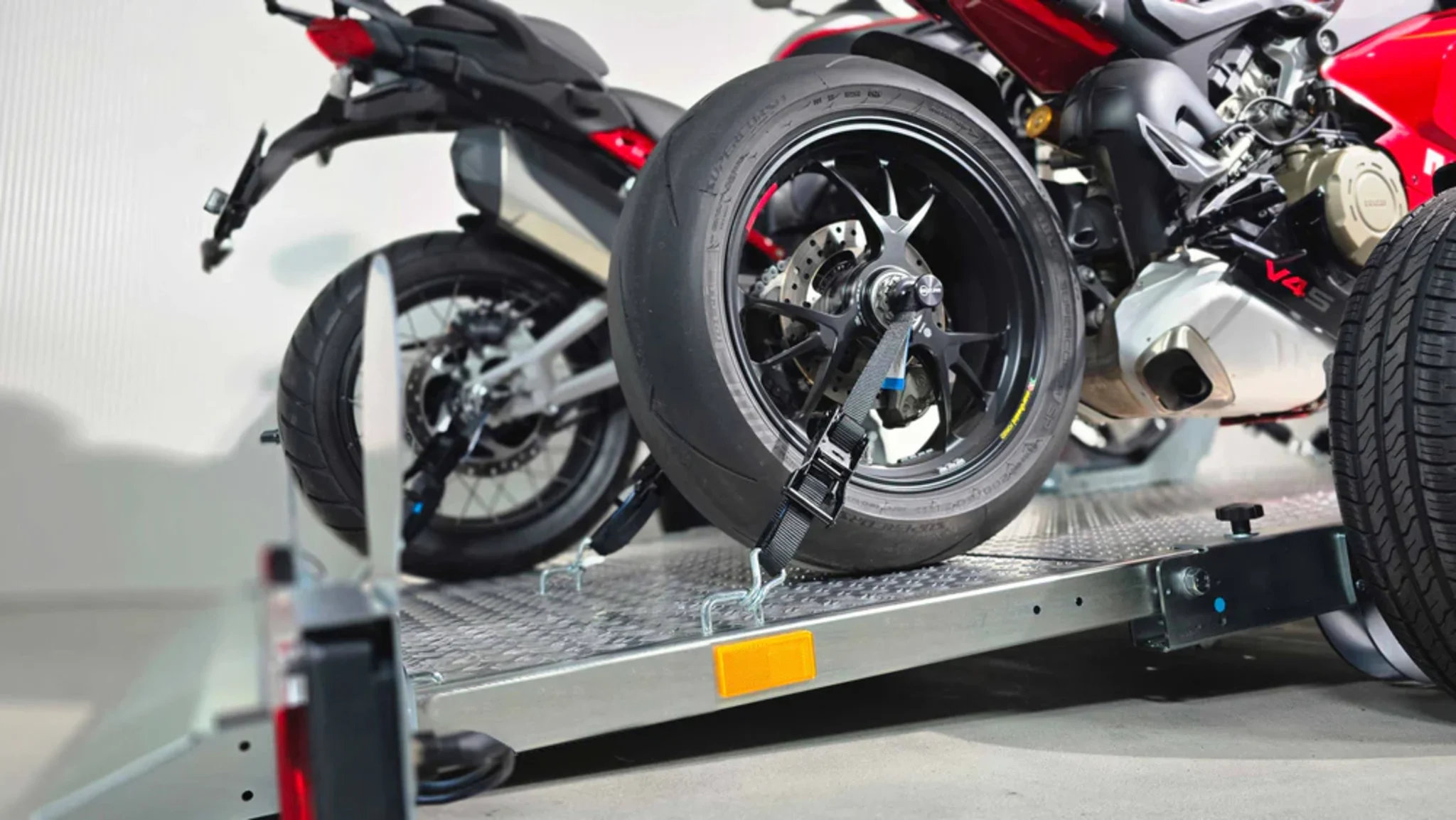 motorcycle being stabilized on a trailer.png